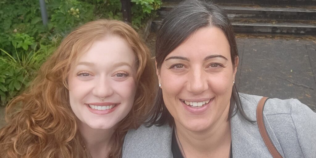 Two women smiling at camera