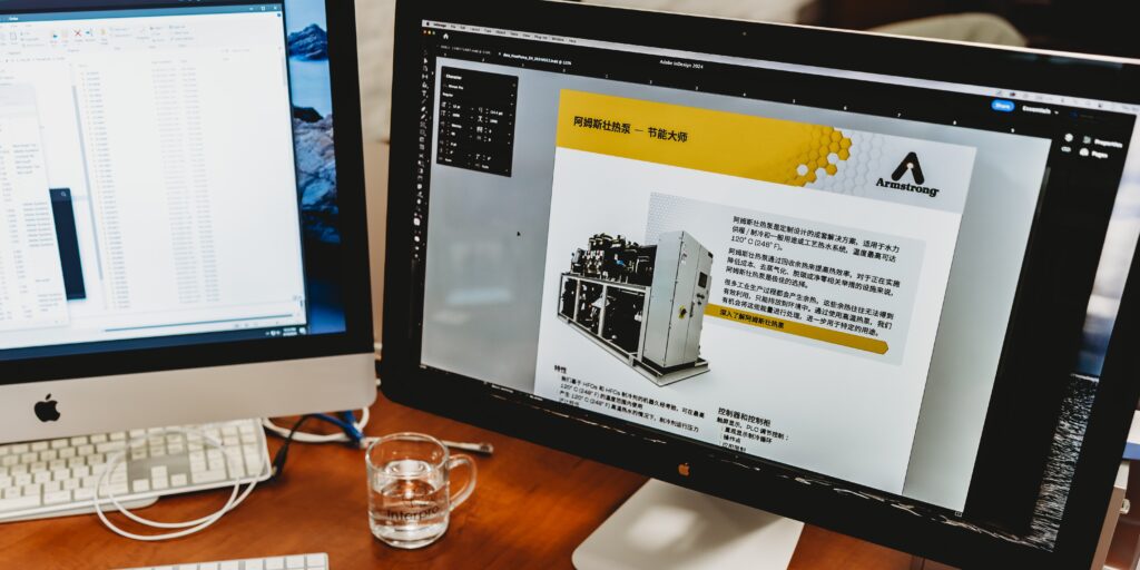 A photo of Interpro’s desktop screen showing an Armstrong technical document being translated in Adobe InDesign