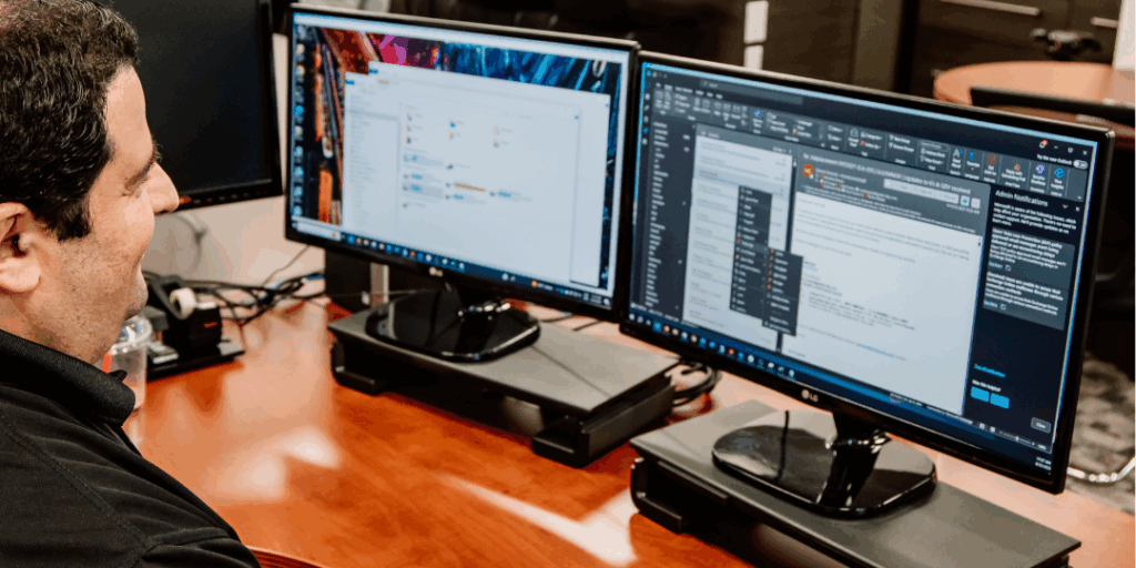 Interpro Chief Technology Officer, Beshar, using translation management software on dual monitors