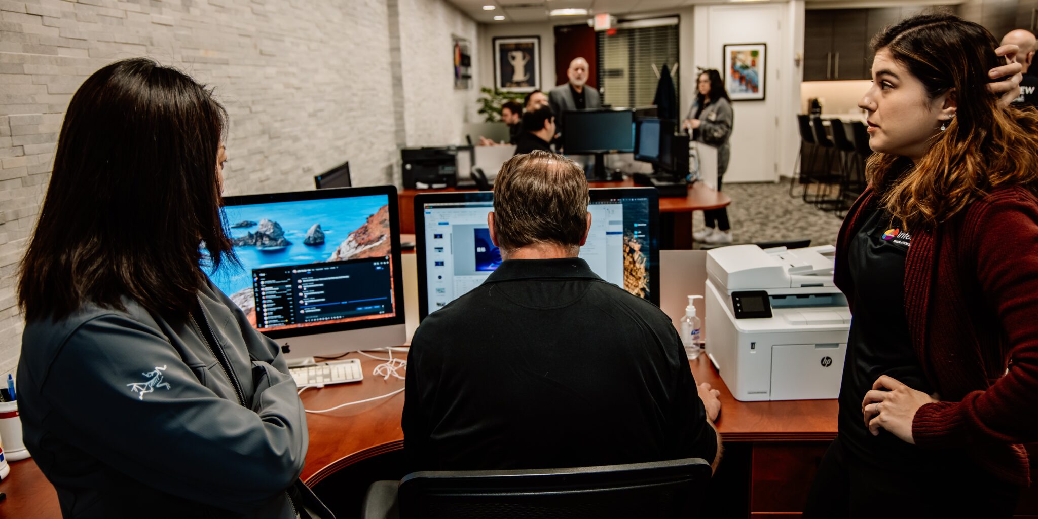 Jolie Parker, Project Manager, reviewing multilingual content workflow at her desk