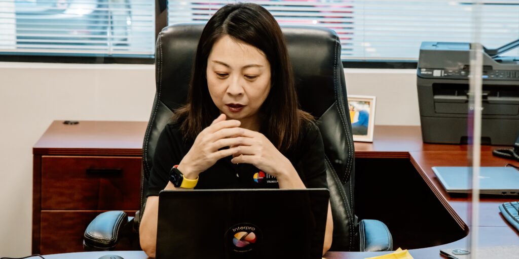 Lei Meng focused at her desk at Interpro’s Chicago headquarters