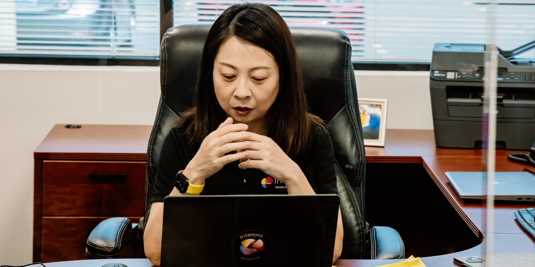 Lei Meng focused at her desk at Interpro’s Chicago headquarters