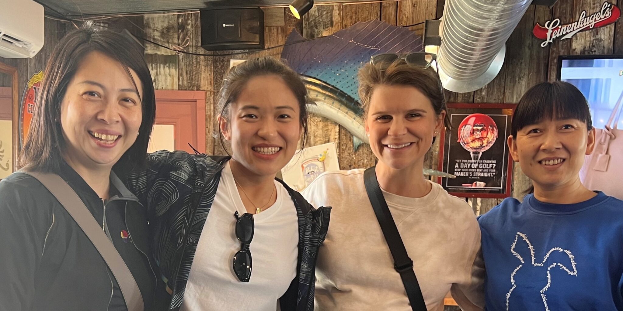 Lei Meng with the Armstrong International China Team at a restaurant