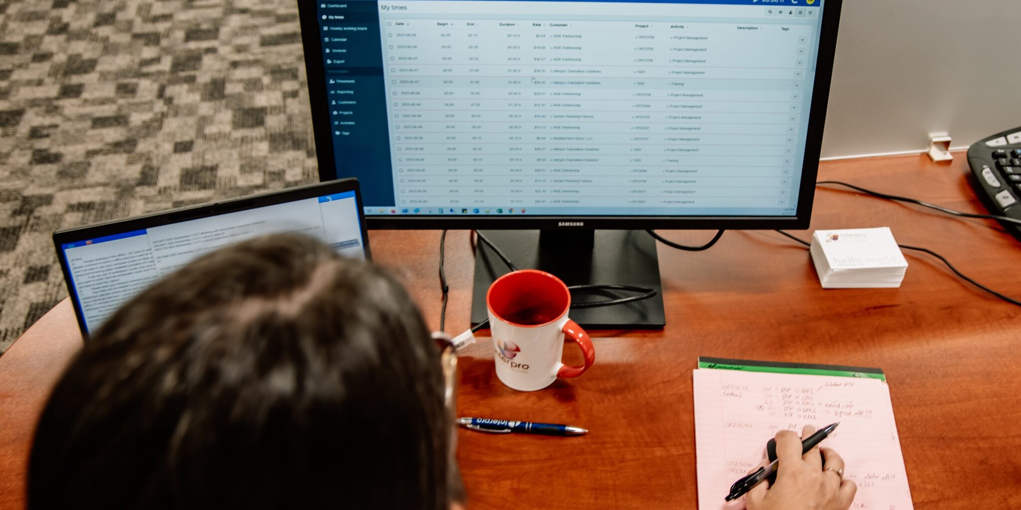 Jolie Parker managing email, Plunet tasks, and team coordination from a home office