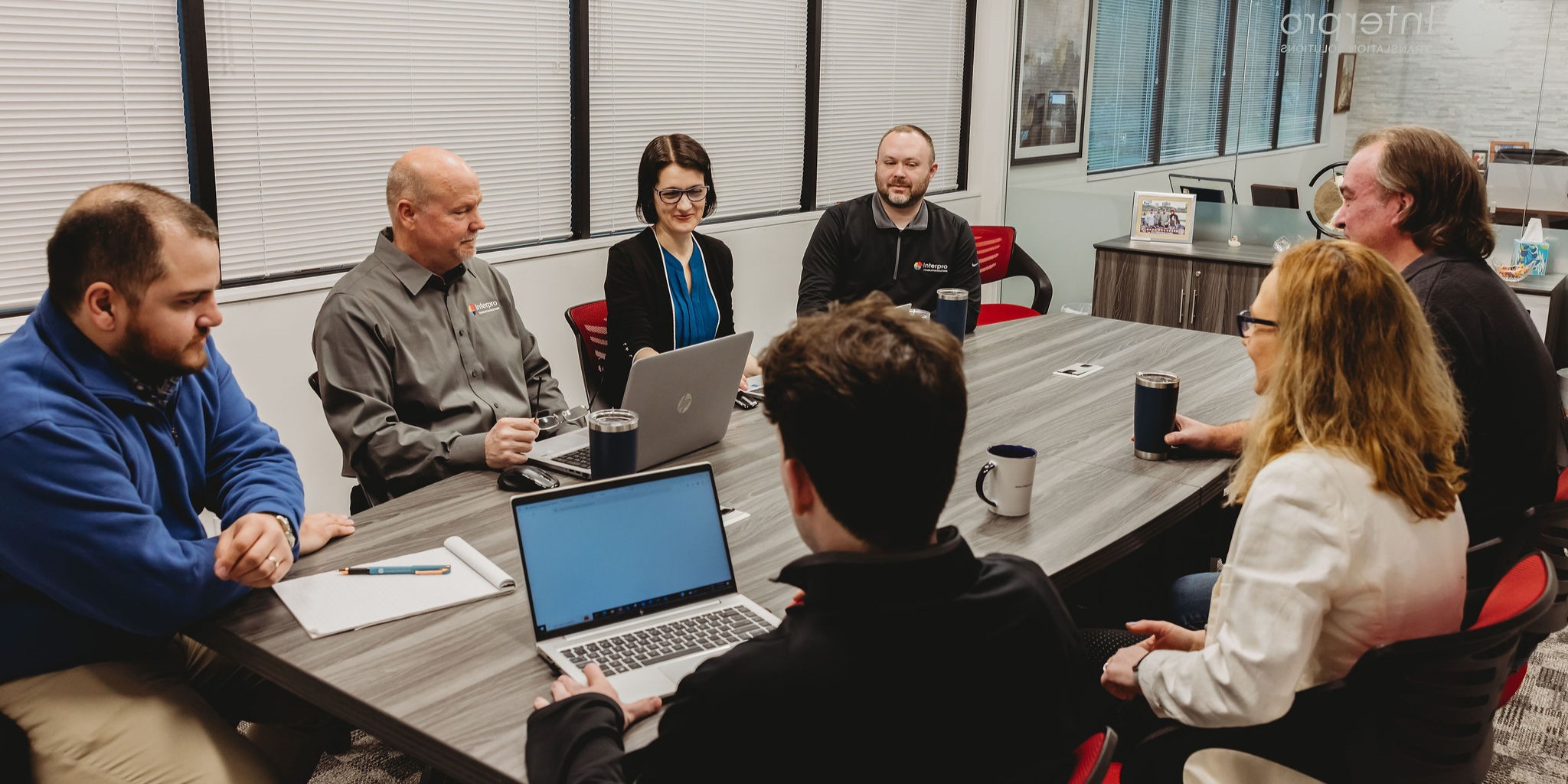 Interpro linguists collaborating on AI translation strategies