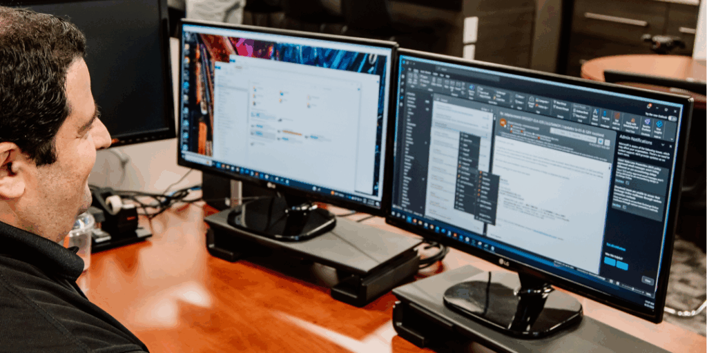 machine translation expert reviewing multilingual content on dual monitors