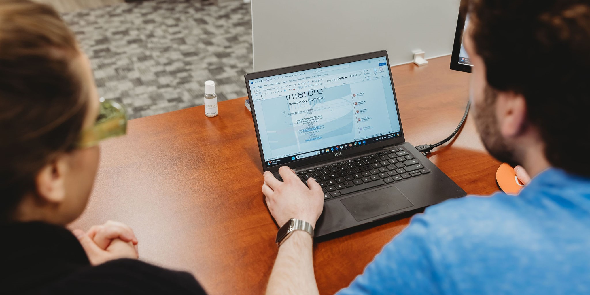 Human linguists reviewing AI-generated translation for quality and accuracy