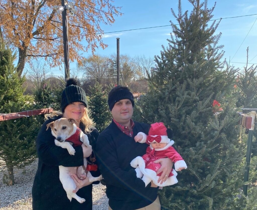 Nick, his Wife, Isabelle, and Winston Christmas tree shopping