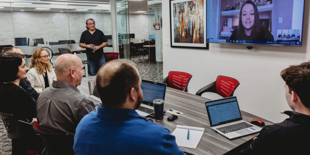 Interpro team meeting with client discussing fractional project management