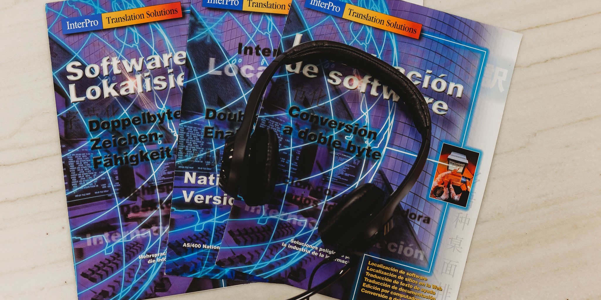 Multilingual software localization brochures in German, Spanish, and Chinese, highlighting Interpro’s commitment to accurate, culturally adapted translation for global digital products.