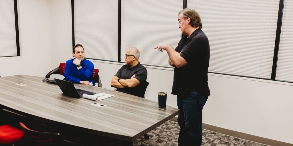 Team discussing internal client review for translation project