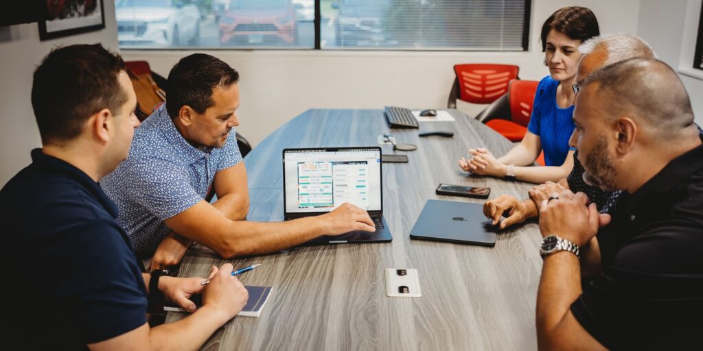 Linguistic quality assurance team reviewing translated content